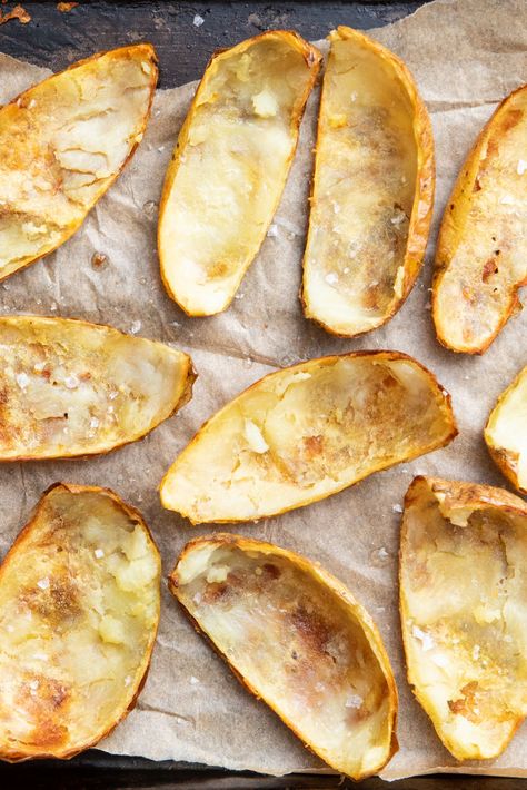 Potato skins are a delicious ingredient, and well worth saving from the compost. They only take 15 minutes in the oven or air fryer to crisp up and are the perfect vehicle for cheesy mashed potatoes. In this guide we bust some potato skin nutrition myths, explain which potatoes are best peeled and which ones can be eaten whole, and explain how to deep fry potato skins to make them extra crunchy. Crispy Potato Skins, Snacks Chips, Roasted Potato, Cheesy Mashed Potatoes, Potato Skin, Great British Chefs, Skin Nutrition, Deep Fry, Recipes Appetizers And Snacks