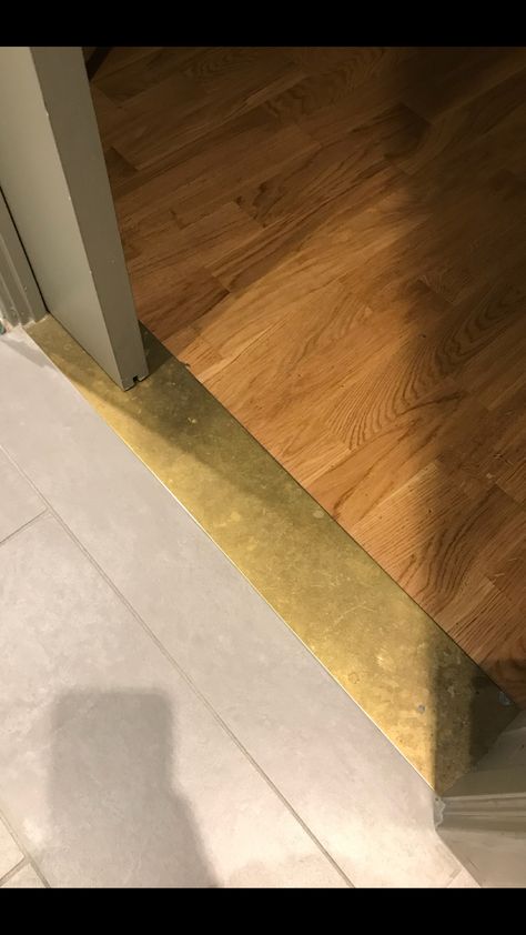 Brass Threshold Brass Strip Floor, Metal Flooring Transition, Brass Threshold Strip, Flooring Threshold Transition, Threshold Ideas Floor, Transitions Between Tile And Wood Floors, Brass Threshold Transition, Floor Threshold Transition, Two Tile Floor Transition