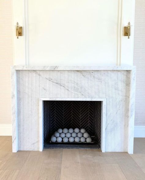 MJ STONE on Instagram: "Fireplaces are always fun to decorate for holidays. We had fun with the craftsmanship on this one. This marble framed marble fluted fireplace is gorgeous!! Simple but breath taking…priceless!! #fireplace #marble #newbuild #homedecor" Fluted Fireplace, Hamptons Fireplace, Fireplace Marble, Mantle Design, Stone Fireplace Surround, Fireplace Frame, Stone Accent Walls, Marble Fireplace Surround, Fireplace Tile Surround