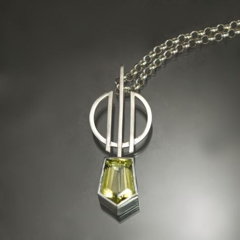 This listing is for a sterling silver and lemon quartz geometric pendant, inspired by Art Deco design motif, strung on a 20" sterling chain.  A strikingly yellow lemon quartz takes center stage in this statement ready pendant. Weighing 9.20 carats, the natural sunny gem has both size and sparkle. Bezel set beneath a geometric emblem of curves and bisecting lines, the symmetry of the stone's crisp silhouette blends seamlessly with the Art Deco sensibilities of the design. Its vibrant simplicity makes it the perfect piece to add an unexpected pop of color or that extra kick of personality to a bright wardrobe. The pendant measures approximately 2 inches and hanging from a 20" chain via concealed bail. It is available to ship within 3 business days. Bright Wardrobe, Linear Art, Art Deco Pendant, Silver Jewelry Design, Art Deco Necklace, Jewelry Techniques, Funky Jewelry, Geometric Pendant, Lemon Quartz