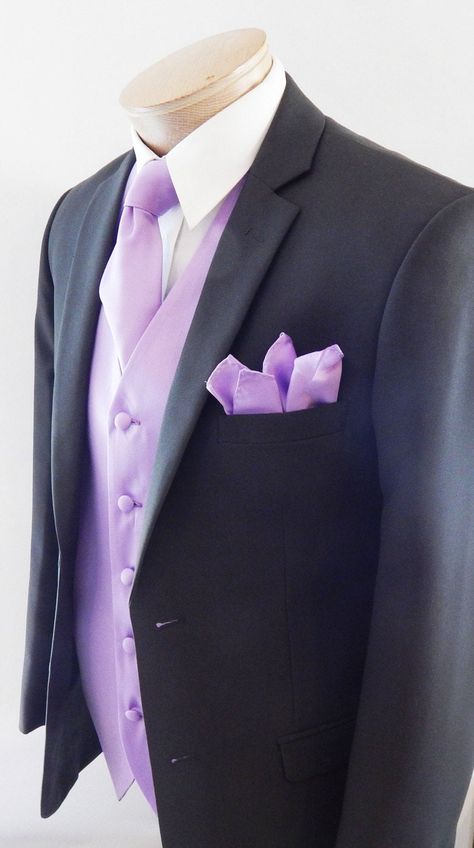 Silk Feel Microfiber Satin Full Back And Adjustable Vest set. The Vest Is Fully Lined With Matching Material Covered Buttons. It Comes With Two Outside Lined Pockets A Regular Four In Hand Tie Measurements Are 58 Inches Long And 3 1/4 Inch Wide With The Matching Fabric Pocket Square. Purple Suits For Men Quince, Light Purple Tuxedo For Men, Black And Lavender Tuxedo, Lilac Quinceanera Chambelanes, Black Suit With Lilac Tie, Lavender Suit Men Wedding, Chambalans Outfits Quince Purple, Light Purple Suits For Men, Purple Quince Chambelanes