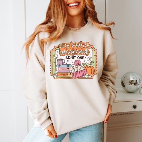 Cozy up with your favourite book in our Cozy Bookish Weekend Sweater 🧡🍵📖 Design by @shop.svgsociety 🫶 Weekend Sweater, Business Thank You, Sweater Design, Handmade Clothes, Sweater Weather, Heat Transfer Vinyl, Heat Press, Colorful Sweaters, Favorite Books