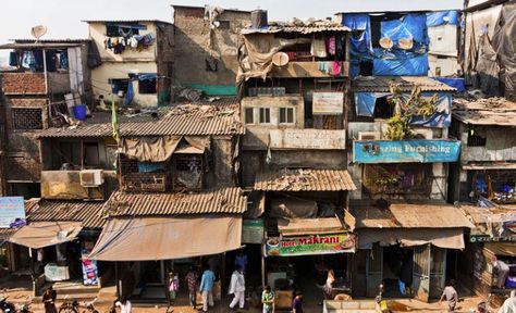 This is a picture of a shantytown/slum in Mumbai. They are common near the airport, where discarded material can help some make a living. Slum House, Dharavi Mumbai, Poor Village, Shanty Chic, India Textiles, Shanty Town, Rock Tumbler, City Planner, Mumbai India