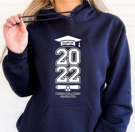 "Class of 2022 Hoodie, Graduation 2022 Hoodie, Family of Graduated Sweatshirt, Graduation Gift Hoodie, High School Graduation Hoodie NovaTerraStore's unisex hoodies are made of premium quality material. The garment Gildan Heavy Blend fits perfectly and feels soft and comfortable. The colours of vinyl and the garment can be chosen according to your taste. We care about: - You, therefore our vinyl was certified by \"REACH\", \" \" Öko-Tex® Standard 100 Class I \". - The Environment, so no animals School Hoodies Design, Grad Hoodies, Phd Graduate, School Hoodies, High School Prom, Prom 2023, Class Of 2022, Congratulations Graduate, High School Graduation