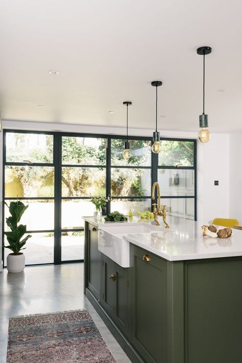 A classic Belfast sink was fitted into this chunky Shaker kitchen island painted in dark sage green, with an aged brass Ionian tap by … in 2019 | Green kitchen cabinets, Green kitchen, Shaker kitchen Shaker Kitchen Island, Green Kitchen Island, Green Kitchen Designs, Dark Green Kitchen, Kitchen Island With Sink, Sage Green Kitchen, Farmhouse Sinks, Devol Kitchens, Green Kitchen Cabinets