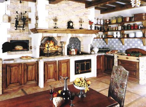 I really like the natural wood and brick colors in this kitchen. My favorite features are the bread oven, fireplace, and shelving. Spanish Kitchen Design, European Kitchen Design, Fabulous Homes, Rustic Italian Home, Counter Cabinet, Italian Kitchens, Cocina Shabby Chic, Old World Kitchens, Kitchens Ideas