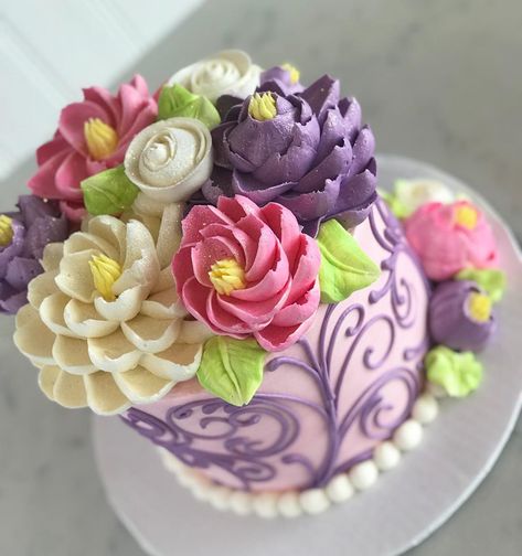 The White Flower Cake Shoppe on Instagram: “Little buttercream cutie in lavenders and pinks! Hope you are having a lovely Tuesday friends! Tip #402 used for large fluffy flowers, tip…” White Flower Cake, White Flower Cake Shoppe, Fluffy Flowers, Flower Cake, White Flower, Beautiful Cakes, Butter Cream, White Flowers, The White