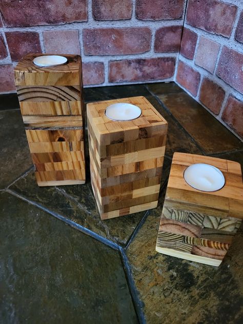 This set of 3 tealight  candle holders  made from reclaimed  compressed  wood pine , Malaleuca wood Ackee wood and red cedar. Every  piece that makes these candle holders has been put in place by hand and finished  by hand showing  it their beautiful  grain and differences  in texture  of the wood leaving  it with a smooth finish... we will be adding  more of this kind of hand made holders , thank you  for your business. Barn Wood Crafts Candle Holders, Woodworking Candle Holder, 4x4 Wood Crafts, Jenga Crafts, Rustic Tealight Holder, Wood Shops, Wood Tea Light Holder, Rustic Wood Candle Holders, Wood Pillar Candle Holders