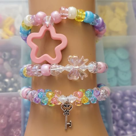 These kandi bracelets are made with cute pastel beads and charms. Includes 3 bracelets. Key charm design will vary depending on stock availability. These are made in all different sizes. This Item is pre made and is ready to be shipped. Perfect for any event! You will get lots of compliments in this unique wearable art! Stand out at your next event! Birthday party  Edm festival  Raves Rave outfit  Festival outfit Pride Pastel Bracelets, Kawaii Kandi, Pastel Kandi, Kandi Jewelry, Rave Candies Bracelets, Candy Rave Bracelets, Rave Candy Bracelets Edm, Kuromi Kandi Cuff, Decora Jewelry