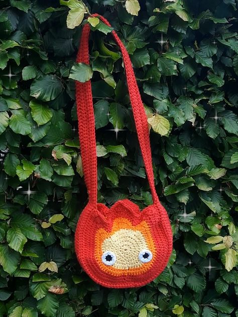 Crochet Calcifer Free Pattern, Howls Moving Castle Knitting, Howls Moving Castle Diy Ideas, Howls Moving Castle Crochet Tapestry, Crocheting Gift Ideas, Studio Ghibli Crochet Bag, Howls Jacket Crochet, Howls Moving Castle Gift Ideas, Calcifer Costume