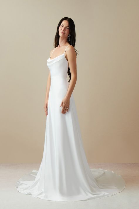 Shiv is our lovely bridal gown cut from crepe back satin. She features a cowl neckline paired with spaghetti straps and a V-back. The look is complete with a chapel length A-line skirt. Modern Elegant Wedding Dress, Scoop Neck Wedding Dress, Moonlight Wedding Dress, Wedding Dress Beaded, Modern Elegant Wedding, Chapel Train Wedding Dress, Azazie Dresses, Silk Wedding Dress, Wedding Dresses Beaded