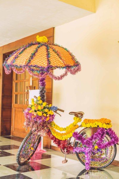 Mehendi Decor - Floral Decorated Cycle as Mehendi Decor | WedMeGood #wedmegood #indianwedding #mehendidecor #decor #floraldecor #cycledecor #marigold Photowall Ideas, Mehendi Decor Ideas, Wedding Hall Decorations, Wedding Entrance Decor, Desi Wedding Decor, Marriage Decoration, Mehndi Decor, Wedding Planning Decor, Beautiful Wedding Decorations