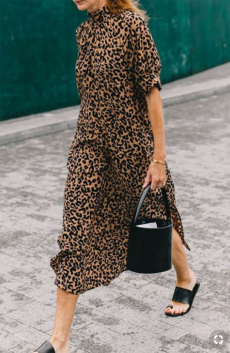 Leopard-print midi dress with black bucket bag and black sandals Printed Dress Street Style, Italian Street Style, Rihanna Street Style, Gigi Hadid Street Style, European Street Style, Light Summer Dresses, Kendall Jenner Street Style, Walking Down The Street, Nyc Street Style