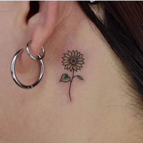 11 Pretty Sunflower Tattoo Ideas for Females 10 Cute Sunflower Tattoo, Tattoo Ideas For Females, Sunflower Tattoo Ideas, Behind Ear Tattoos, Finger Tattoo For Women, Finger Tats, Hand And Finger Tattoos, Flower Wrist Tattoos, Cute Sunflower