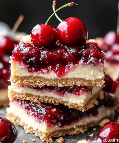 Christmas Cherry Cheesecake Bars No Bake Cherry Cheesecake Bars, Merry Cherry Cheesecake Bars, Baked Cheesecake Bars, Cherry Crumble Cheesecake, Christmas Cherry Bars Taste Of Home, Black Cherry Cheesecake, Christmas Cherry Cheesecake, Cherry Christmas Bars, Cherry Cream Cheese Bars