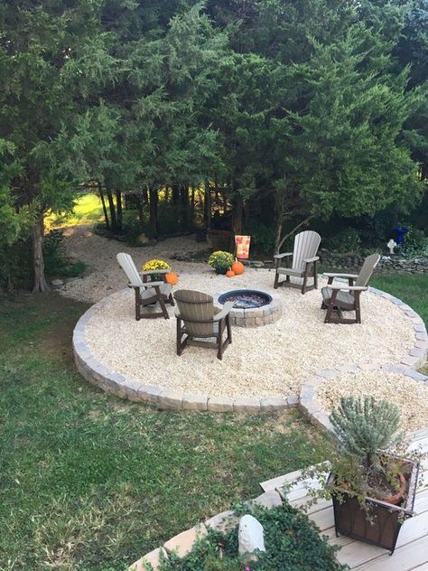 Fire Pit With Pool Ideas, Fire Pit Ideas In The Woods, Raised Deck With Fire Pit, Square Firepits Backyard Ideas, Stone Firepits Backyard Diy, Raised Fire Pit Area, Fire Pit On Sloped Yard, Landscape Around Fire Pit Area, Pebble Fire Pit Area