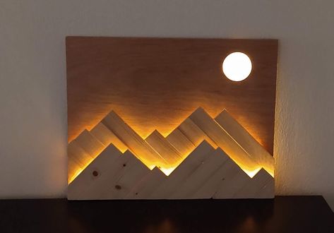 Made using wood and LED strips Wood Pallet Wall Art, Wall Planters Indoor, Pallet Wall Art, Wood Wall Art Diy, Mdf Crafts, Wooden Pallet Furniture, Led Decor, Wooden Wall Decor, Creative Furniture