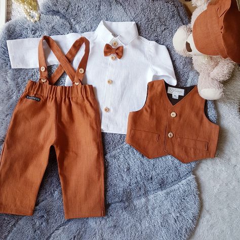 End Of Summer Wedding Ideas, Terracotta Country Wedding, Ring Bearer Fall Wedding, Groom Suit Fall Wedding, Ring Bearer Outfit Fall, Boho Ring Bearer Outfit, Terracotta Ring Bearer Outfit, Terracotta Fall Wedding, Burnt Orange Vest Wedding