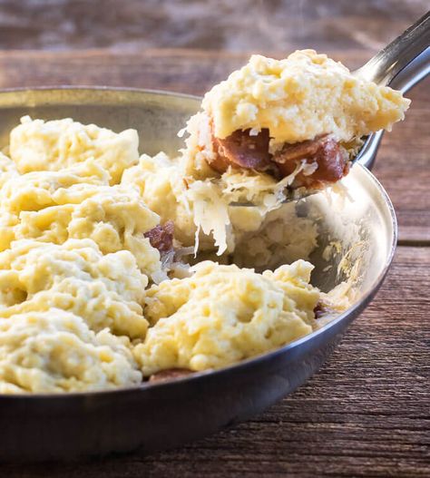 Sauerkraut and Dumplings with Kielbasa being scooped from skillet Sauerkraut And Dumplings, Dumplings And Sauerkraut, Sausage Dumplings, Kielbasa Recipe, Sauerkraut Recipe, Pork Dumplings, Bread Dumplings, Homemade Sauerkraut, Pork Dumpling