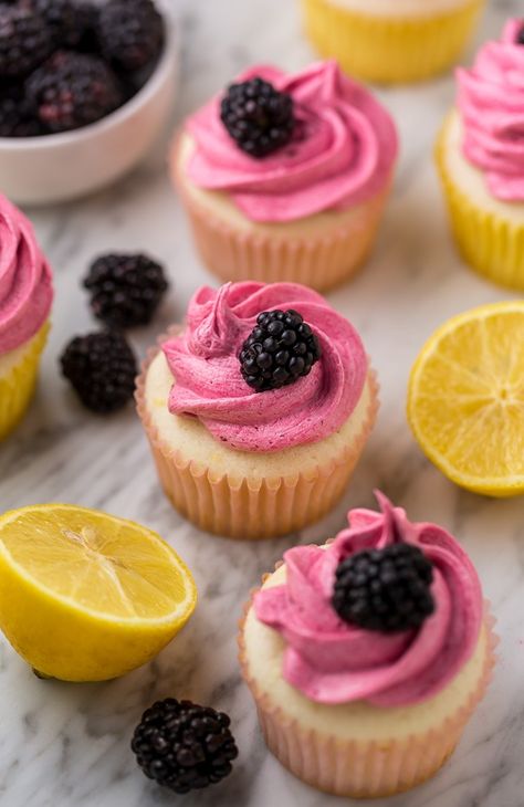 Fluffy Lemon Cupcakes are topped with BLACKBERRY Buttercream! These Lemon Blackberry Cupcakes are so pretty and always a showstopper. Their refreshing flavor makes them perfect for Spring and Summer celebrations! Moist Lemon Cupcakes topped with Fluffy Blackberry Buttercream Fact: I'm a little cupcake obsessed this Summer. Cannot get enough of them! Doesn't matter if they're Super Blackberry Buttercream, Blackberry Cupcakes, Berry Cupcakes, Lemon Recipe, Lemon Cupcakes, Cupcake Flavors, Cheesecake Brownies, Treat Recipes, Sweet Breads