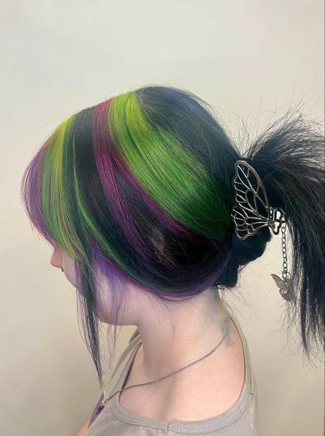 green, magenta, purple, black, striped hair. Chunky highlights Black Hair With Rainbow Streaks, Stripes Dyed Hair, Hair Dye With Black Hair, Purple And Green Hair Streaks, Blonde Purple And Green Hair, Purple And Gold Hair, Green Black And Purple Hair, Black And Green Striped Hair, Green Hair With Blonde Highlights