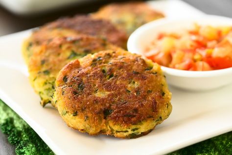 Greek Style Kolokithokeftedes Recipe is a simple patty made from grated Zucchini and paneer. It is then packed with simple herbs like mint and spring onions. The fritter is pan fried till it is crispy on the outside and soft inside. This mixture can be made and kept up for three days and can be used whenever necessary for a quick snack. Serve the Greek Style Kolokithokeftedes Recipe (Squash Fritters Recipe) as a Part Appetizer or just as Tea Time Snack along with A Greek Yogurt Dip and Kolokithokeftedes Recipe, Zucchini Fritters Recipe, Zucchini Fritters, Fussy Eaters, Fritter Recipes, Tea Time Snacks, Hummus Recipe, Zucchini Recipes, Quick Snacks