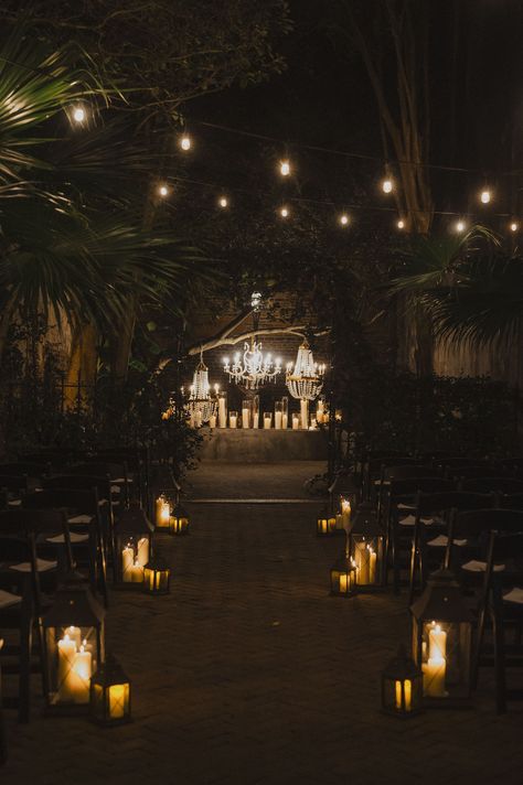 Welcome to your dark fantasy wedding dreams ✨. A candlelit after-dark courtyard ceremony with dazzling chandeliers? This romantic dark romance wedding has us spellbound. Dark Courtyard, Dark Fantasy Wedding, Courtyard Wedding Ceremony, Candlelight Wedding Ceremony, Dark Romance Wedding, Courtyard Ceremony, Candlelit Wedding Ceremony, Candlelight Wedding, French Quarter Wedding