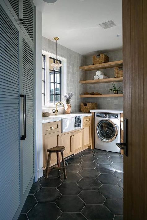 Laundry Room Black Floor, Black Hexagon Floor, Louvered Closet Doors, Laundry Room Black, Traditional Home Magazine, Country Laundry Rooms, Hexagon Floor, Laundry Room Flooring, Sophisticated Bathroom