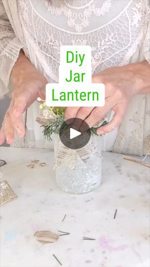 6.8K views · 158 reactions | DIY Jar Lantern | Upcycled this jar into a charming DIY lantern, adding a warm glow to my cozy space! 🕯️✨ #Upcycle #DIYHomeDecor | By Olivia's Romantic Home DIY | Let's upcycle this salsa jar
and create a beautiful Christmas lantern idea. Okay so
I had this salsa jar cleaned it out really well and then taking
a layer of Mod Podge. I'm adding that Mod Podge to the
exterior of my container and then adding some of this
glitter that I found at Walmart. They come in huge
packages. You guys can really get glitterfit this Christmas.
I dug into my craft stash. I had this pretty golden
sparkling ribbon from last season and then just adding
some bits and bobs with some greenery and you guys could get
so creative with this part and really make it shine. Make it
fit your Christmas Jar Lanterns, Decorated Jars Ideas, Hand Crafts Ideas Creative, Salsa Jar, Christmas Lantern Ideas, Easy Winter Crafts, Diy Lantern, Diy Jar, Mason Jar Lanterns