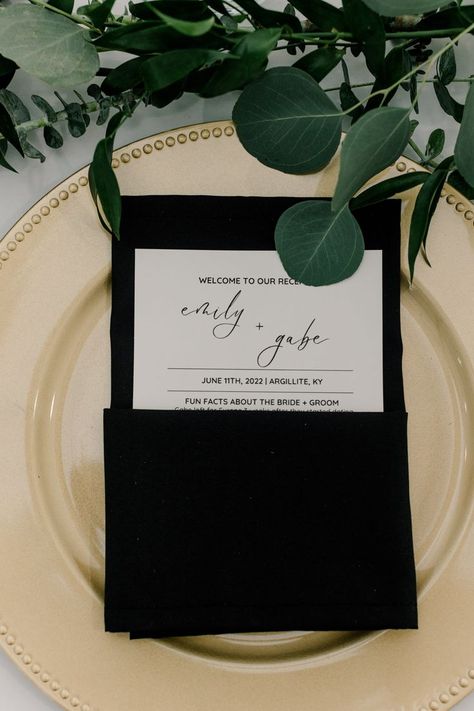 Adding a black napkin and a cute informational card over our chargers helped elevate our table setting and allowed for the guest to have something to read during cocktail hour. Black Wedding Table Setting, Wedding Napkin Folding, Black And Gold Wedding, White Weddings Reception, Black And White Wedding Theme, Black Napkins, Wedding Table Setting, Gold Chargers, White Wedding Theme