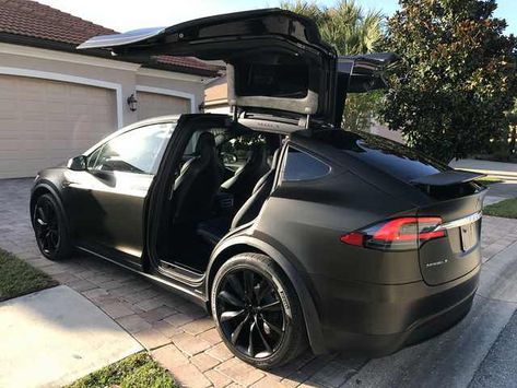 Tesla Model X Black Satin Gold Dust Vinyl Wrap with Carbon Fiber Accents on Chrome and all 6 seat backs. - Imgur Tesla Model X Black, Tesla X, Luxury Cars Rolls Royce, New Luxury Cars, Tesla Motors, Tesla Car, Tesla Model X, Gold Dust, Expensive Cars