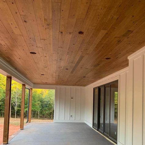 23 Porch Ceiling Ideas and Designs (with Photos) Patio With Wood Ceiling, Stained Ceiling Porch, Front Porch Wood Ceiling Diy, Wooden Patio Ceiling, Car Siding Ceiling Living Rooms, Wooden Porch Ceiling, Adding A Back Porch To A House, Porch Ceilings Wood, Exterior Porch Ceiling Ideas