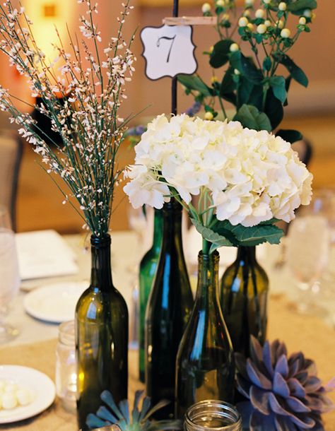 Partial centerpiece idea... Thinking I want to add hydrangeas and peonies.  Totally loving the idea Wine Bottle Flowers, Beautiful Wedding Centerpiece, Wine Bottle Vases, Wine Bottle Centerpieces, Deco Champetre, Bottle Centerpieces, Theme Inspiration, Rustic Wedding Centerpieces, Wine Bottle Diy