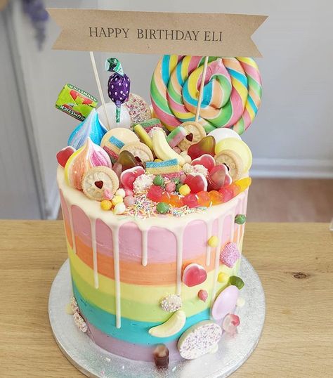 Extra Tall Rainbow Sweetie Overload 🌈🍬🍭🌈 . . . . #cake #cakeshop #bakery #bake #butterfingers #cakeinspiration #cakestagram… Sweets Cake Ideas, Sweet Treats Cake, Sweetie Cake Ideas, Rainbow Cake With Lollipops, Rainbow Layer Cake Birthday, Sweetie Cakes Birthday, Birthday Cake Sweets, Rainbow Lolly Cake, Birthday Cake Lollipop