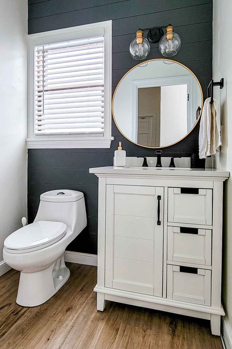 An easy small bathroom remodel with charchoal shiplap featured wall, white vanity and a 2-light fixture. Powder Room Remodel, Small Bathroom Vanities, Small Vanity, Small Bathroom Makeover, White Vanity Bathroom, Downstairs Bathroom, White Vanity, Basement Bathroom, Upstairs Bathrooms