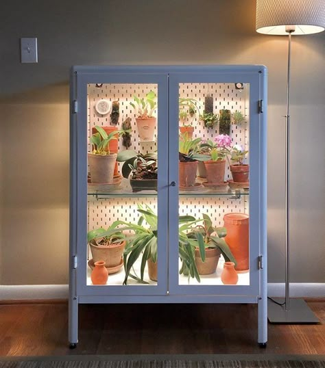 One of the more genius uses of IKEA's Fabrikör cabinet is completely hacking the cabinet into an indoor greenhouse. Plant Organization, Rainforest Room, Plant Studio, Office Vibes, Indoor Greenhouse, Greenhouse Ideas, Garden Inspo, Inside Plants, Ikea Cabinets