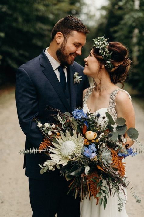 This camp wedding features some of the most incredible exotic flowers we've ever seen | image by Kaihla Tonia Photography #rusticweddinginspo #campweddinginspo #fallweddinginspo #weddingphotoinspiration #weddingphotoideas #weddingportrait #couple #cutecouple #coupleportrait #firstlook Eucalyptus Wedding Bouquet, Protea Wedding, Protea Bouquet, Bouquet Images, Tulip Wedding, Orange Bouquets, Cascading Wedding Bouquets, Peony Bouquet Wedding, Winter Wedding Bouquet