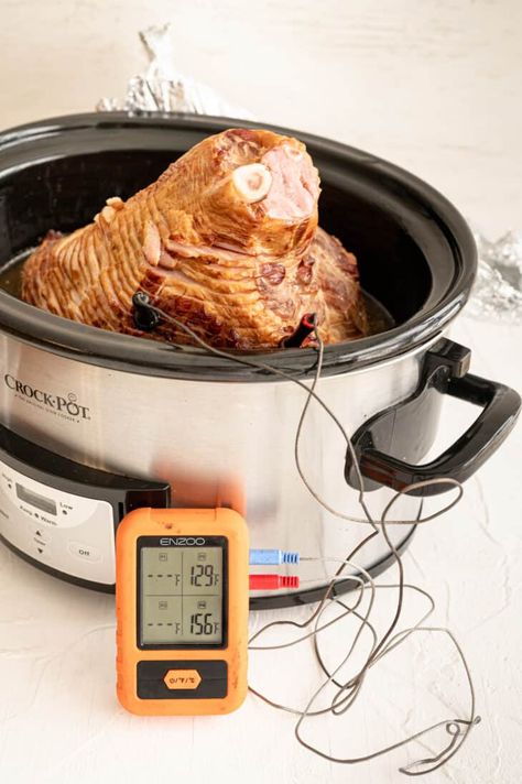 If you need your oven for other purposes, our Crockpot Ham is here to save the day. After a lot of testing and research, we found the best way to slow cook a spiral ham and how to avoid a dried out piece of pork. Serve with our 5-ingredient Pineapple Sauce for an impressive yet easy meal. Honey Baked Ham Recipe Copycat, Honey Baked Ham Recipe, Ham Recipes Baked, Whole Ham, Kitchen Torch, Pineapple Sauce, Honey Baked, Spiral Ham, Crockpot Ham