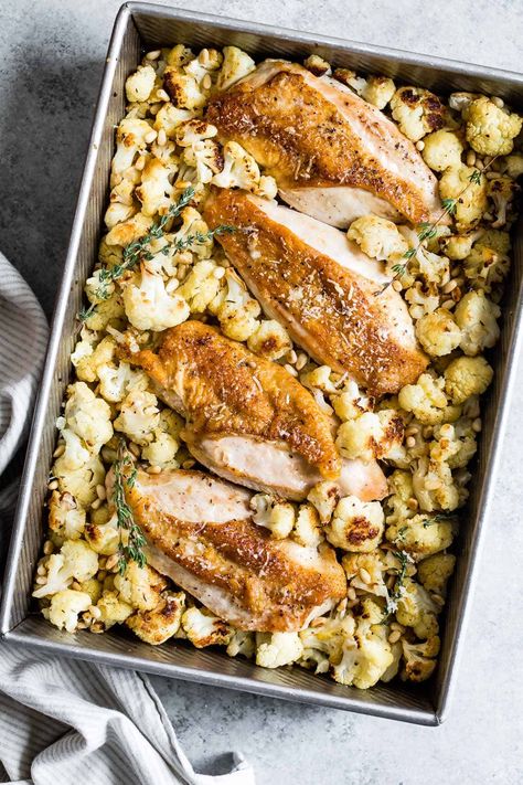 This chicken sheet pan dinner recipe is an easy way to get dinner on the table without much fuss. Lemon parmesan roasted cauliflower and crispy chicken breast tastes great on its own or served over buttered pasta! #recipe #sheetpandinner #sheetpan #dinner #chicken #chickenbreast #lemon #cauliflower #parmesan #healthy #glutenfree Roasted Cauliflower And Chicken, Buttered Pasta, Lemon Cauliflower, Fall Chicken Recipes, Chicken Sheet Pan Dinner, Cauliflower Parmesan, Crispy Chicken Breast, Chicken Sheet Pan, Parmesan Roasted Cauliflower