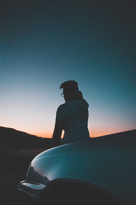 man sitting in front of car photo – Free Grey Image on Unsplash Sitting On Car Hood, Golden Glasses, Wallpaper Man, Aesthetic Picture Ideas, K Project Anime, Portraits Inspiration, Silhouette Photography, K Project, Sky Full Of Stars