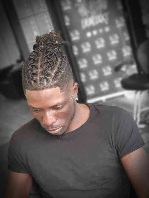 Braids For Dreads Men, Dreads Updo Styles Men, Halo Loc Styles Men, Men Locs Hairstyles Black Man Updo, Short Dread Styles For Men Shaved Sides, High Top Locs Styles For Men, Locs With Shaved Sides Men, Professional Dreadlock Hairstyles Men, Barrel Twist Dreads Men High Top