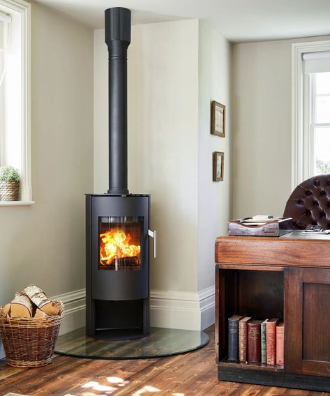 Wood burner ideas: 12 cozy designs and expert installation tips | Homes & Gardens Wood Burner Flat Wall, Woodburner In Kitchen, Flooring Under Wood Stove, Tiny Home Wood Stove, Blaze King Wood Stove, Zero Clearance Fireplace Wood Burning, Small Living Room With Wood Stove, Corner Wood Stove Hearth Ideas, Wood Stove In Corner