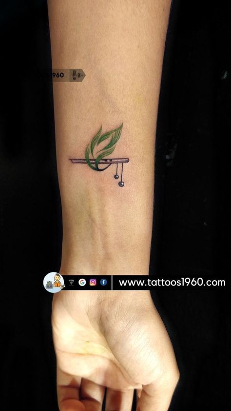 Peacock Feather Tattoo On Wrist, Peacock And Flute Tattoo, Kanha Tattoo Design, Tatvamasi Tattoo, Flute And Peacock Feather Wallpaper, Krishna Symbol Tattoo, Flute With Peacock Feather Drawing, Flute With Feather Tattoo Designs, Shree Krishna Tattoo Design