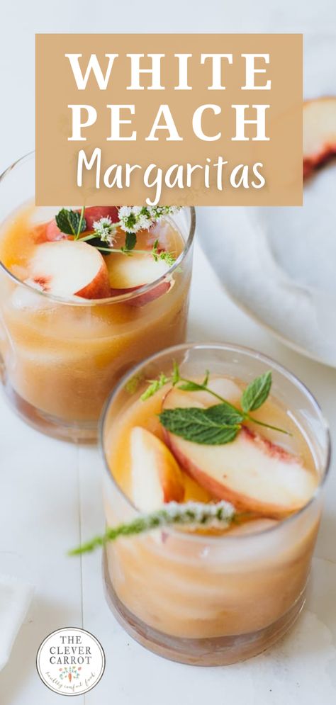 These white peach margaritas are so delicious--like a happy hour smoothie! They are super easy to make, and ready in just about 5 minutes. They get a beautiful color from the honey used to sweeten them, and I serve them granished with mint for a pretty finish. White Peach Drink Recipes, White Peach Cocktail, White Peaches, Peach Margarita Recipe, White Peach Recipes, White Peach Margarita, Hot Honey Peach Margarita, Peach Mango Margarita Recipe, Peach Margarita Recipes