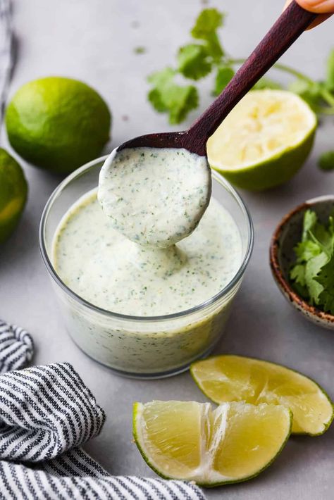 Once you taste this creamy cilantro lime sauce, you'll want to drizzle it on everything in sight! It's a tasty mix of sour cream, cilantro, salsa verde, lime juice, garlic, salt, and pepper. Perfect for grilled meats, salads, tacos, and more! Cilantro Lime Crema Recipe, Lime Sauce Recipe, Creamy Cilantro Lime Sauce, Burrito Sauce, Cilantro Tacos, Cilantro Garlic Sauce, Lime Salad Dressing, Cilantro Salsa, Verde Sauce