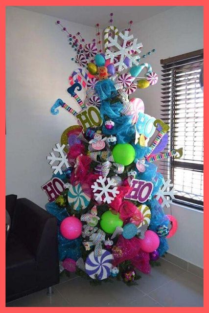 Check out How to create awesome Christmas Trees. Because a Christmas Tree lights up a house with goodwill. #christmasideas #christmasdecor #christmas #ChristmasTrees #tree #christmastree Colored Christmas Tree, Candy Christmas Tree, Funny Christmas Tree, Rainbows Christmas, Garden Indoor, Creative Christmas Trees, Unique Christmas Trees, Christmas Tree Inspiration, Cool Christmas Trees