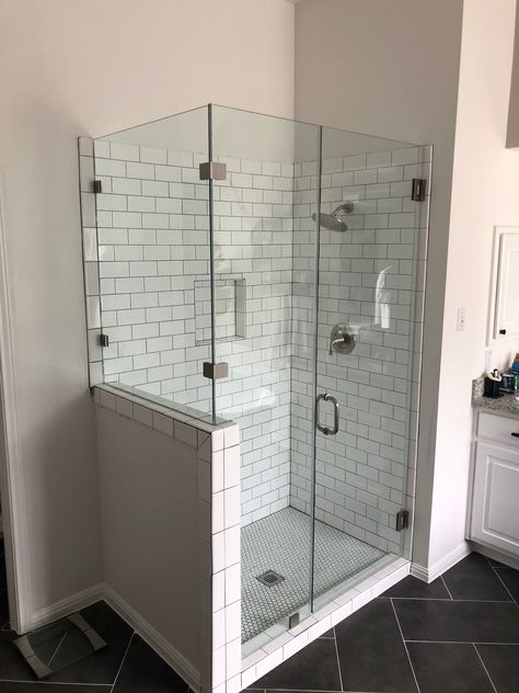 Shower With Two Glass Walls, Frameless Shower Doors With Pony Wall, Full Glass Shower Enclosure, Diy Glass Shower Enclosure, Glass Wall Shower Ideas, Swan Stone Shower Walls, Shower Door With Half Wall, Glass Shower Ideas, Shower Enclosure Ideas