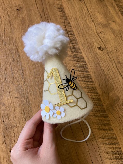 Excited to share this item from my #etsy shop: Bee Birthday Hat, Floral Bee Party Hat, Pom Pom Party Hat, 1st Bee-Day Party Prop Pom Pom Party, Bee Birthday Theme, Bee Themed Birthday Party, Bee Hat, Bumble Bee Birthday, Hat Pom Pom, Bee Birthday Party, First Birthday Hats, Baby Birthday Decorations