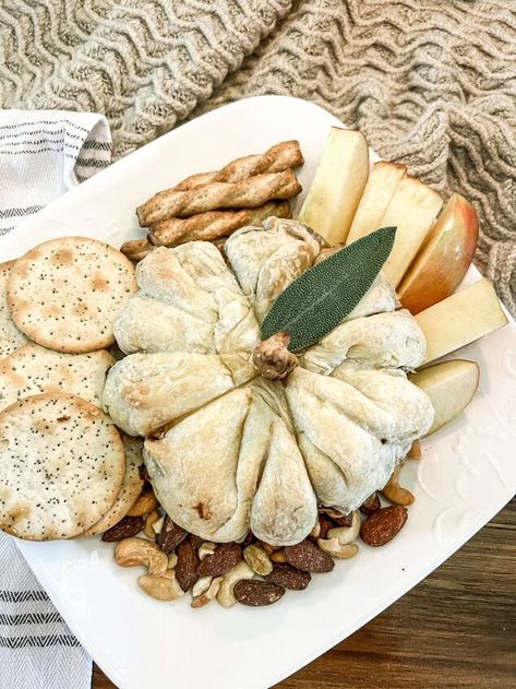 Warm and gooey pumpkin baked brie is an easy appetizer that you Baked Brie Sunflower, Pumpkin Baked Brie Puff Pastries, Apple Butter Baked Brie, Pumpkin Brie Appetizer, Pumpkin Brie Puff Pastries, Fall Baked Brie Appetizer, Fall Brie Appetizer, Fall Baked Brie, Brie Pumpkin