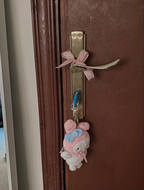 brown door with a doorknob with a ribbon tied on it, and My Melody keychain on the door Coquette Door Decor, Coquette Door, My Melody Keychain, Dorm Door, Coquette Room, Pink And, Pretty Pink Princess, Perfect House, Pink Houses